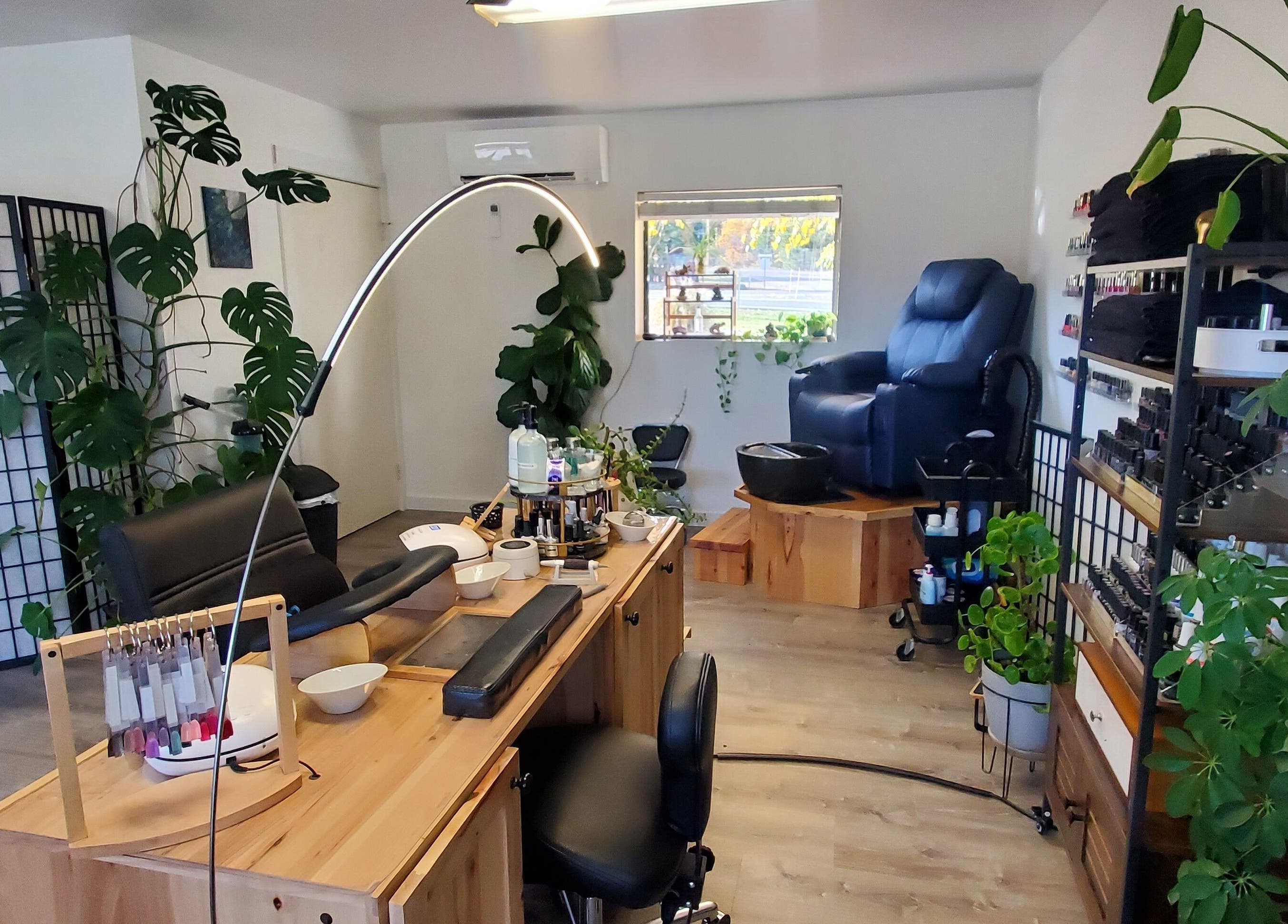 Inviting manicure and pedicure space at Royal Digits in Etna, California, US, adorned with lush greenery.