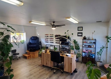 Royal Digits beauty salon interior in Etna, California, US, showcasing a nail station and cozy seating.