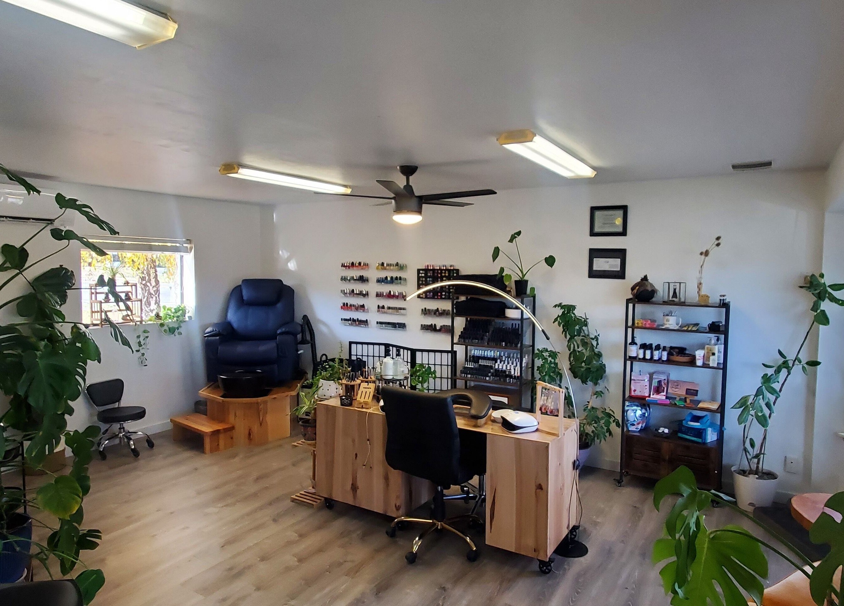 Royal Digits beauty salon interior in Etna, California, US, showcasing a nail station and cozy seating.