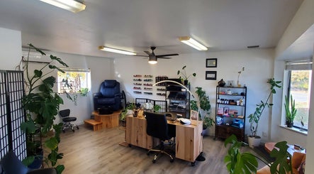 Royal Digits beauty salon interior in Etna, California, US, showcasing a nail station and cozy seating.
