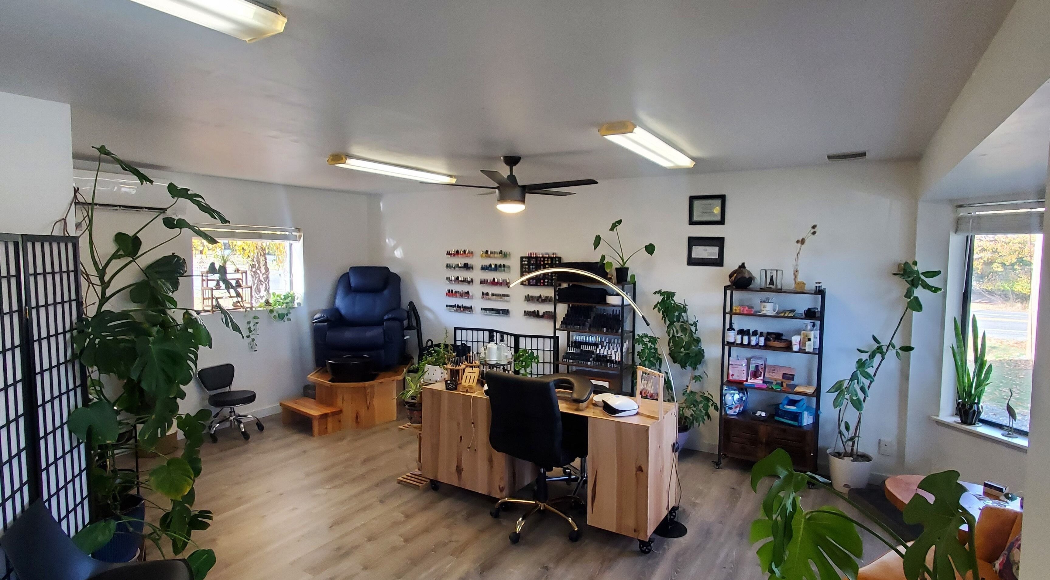 Royal Digits beauty salon interior in Etna, California, US, showcasing a nail station and cozy seating.