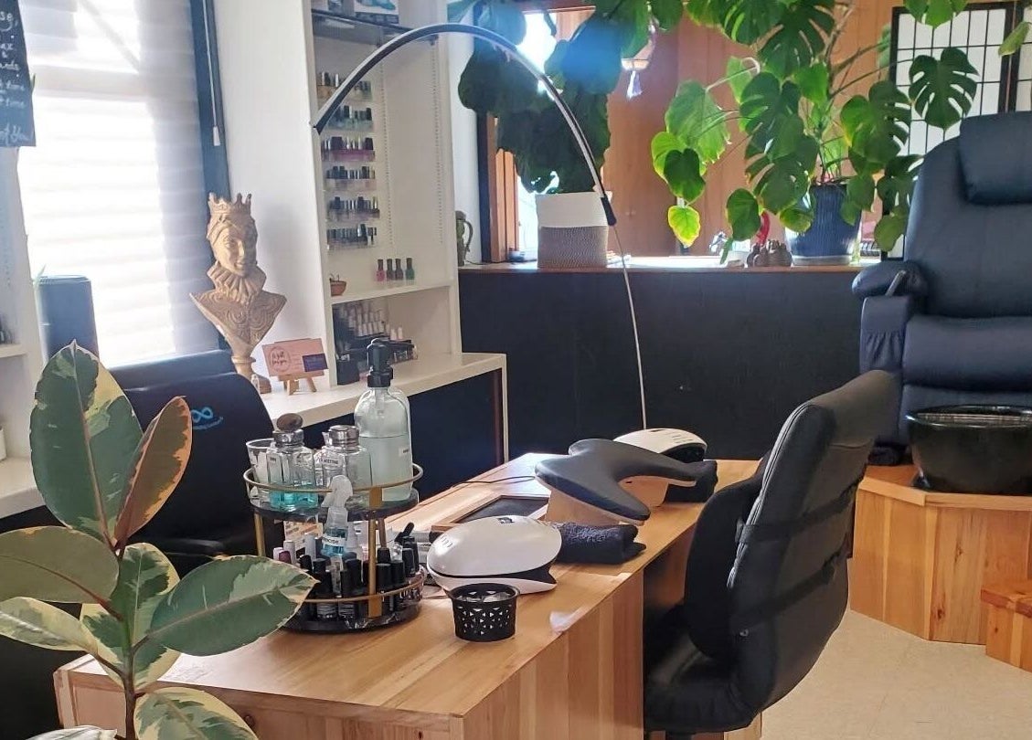 Royal Digits nail salon in Etna, California, US with a manicure station and cozy seating.