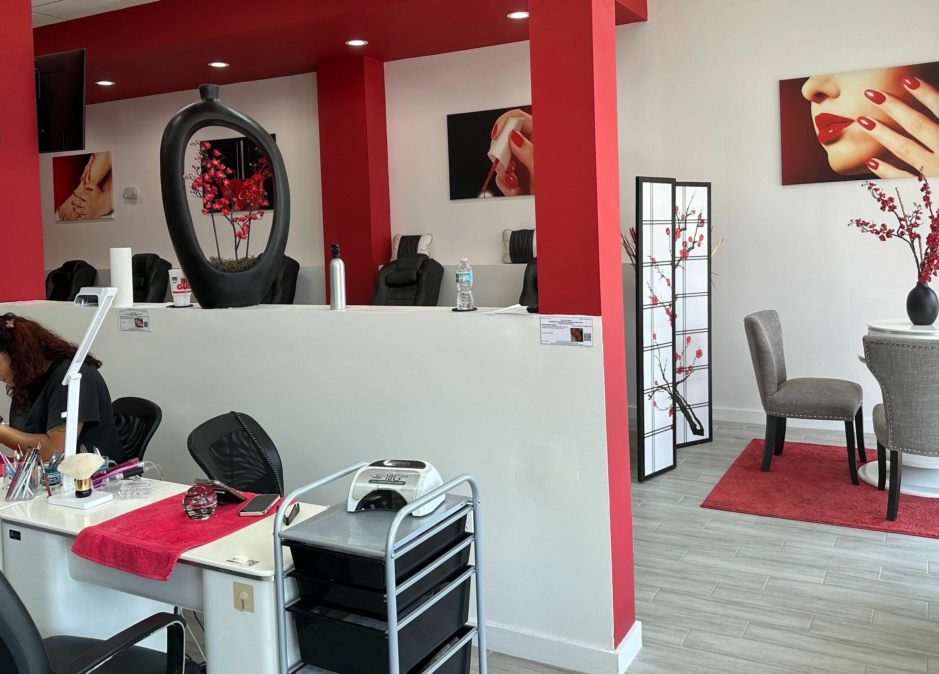Modern interior of Blossom Nails in Sanford, Florida, featuring a chic manicure station and stylish decor.