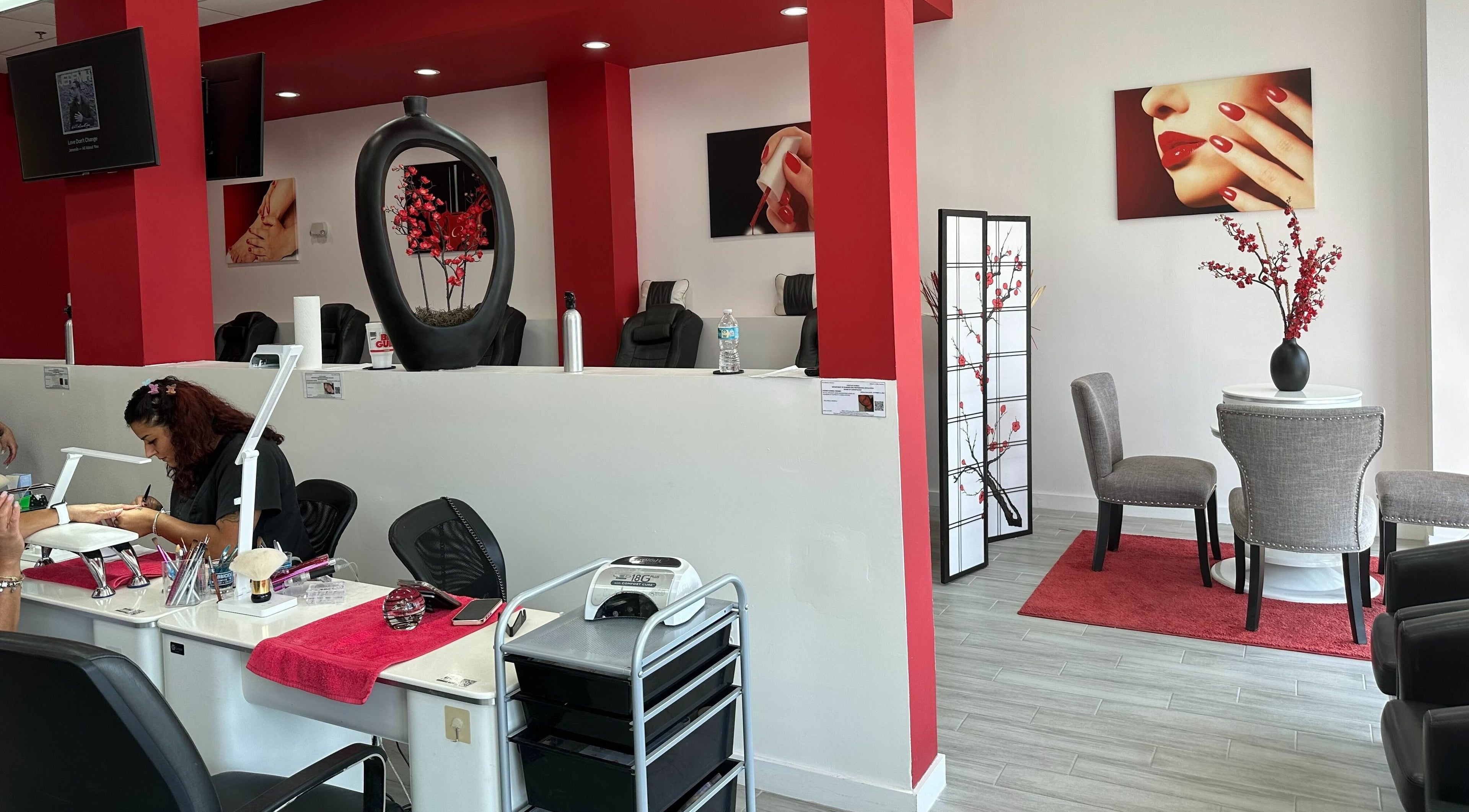 Modern interior of Blossom Nails in Sanford, Florida, featuring a chic manicure station and stylish decor.