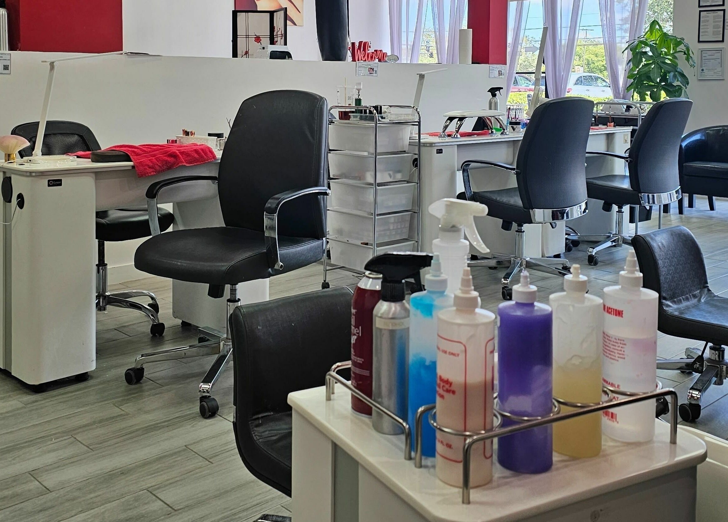 Cozy interior of Blossom Nails in Sanford, Florida, US with comfortable chairs and nail care essentials.