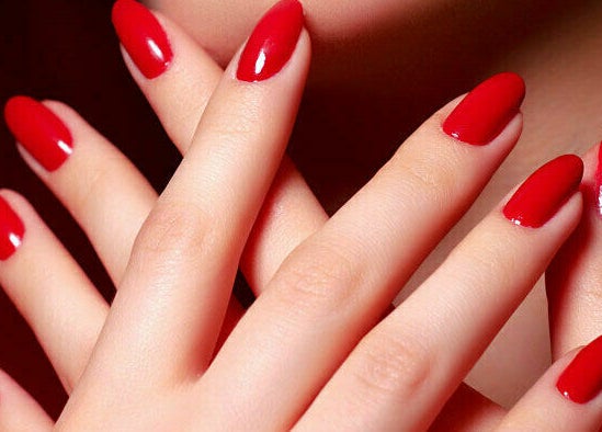 Vibrant red manicure at Blossom Nails in Sanford, Florida, US showcasing perfect nail artistry.