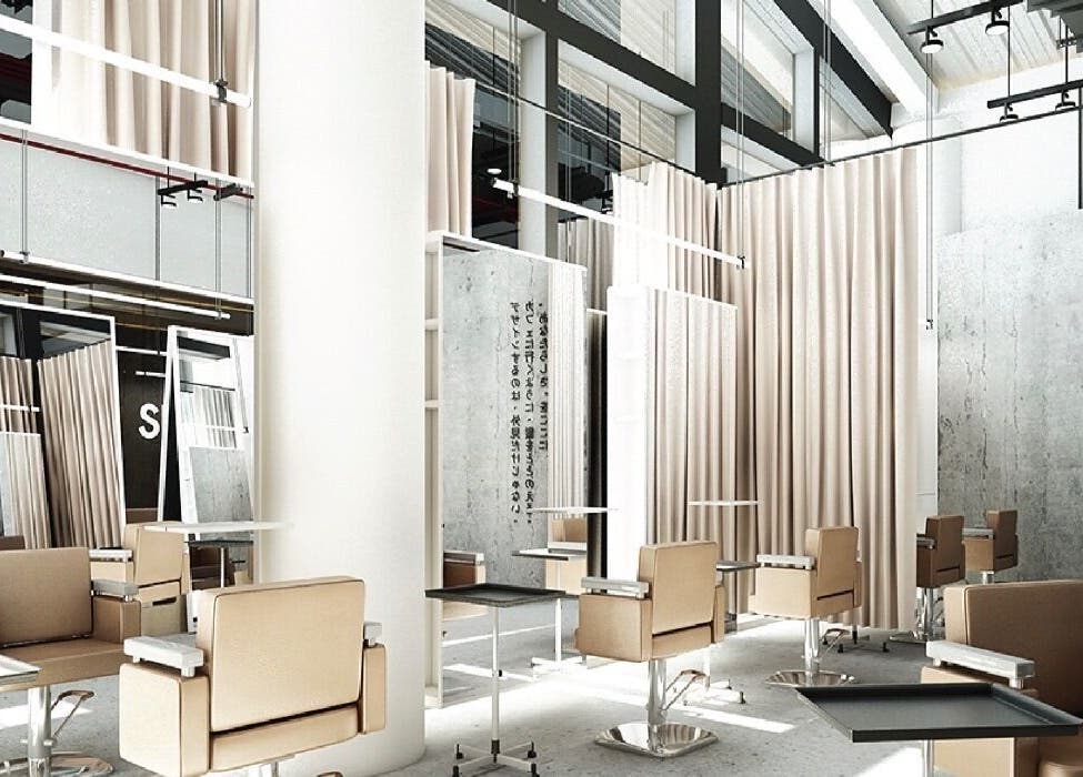 Modern salon interior at SHIN by AKIENDO in Krung Thep Maha Nakhon with sleek chairs and mirrors.