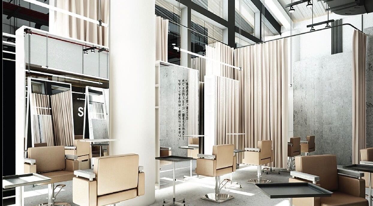 Modern salon interior at SHIN by AKIENDO in Krung Thep Maha Nakhon with sleek chairs and mirrors.