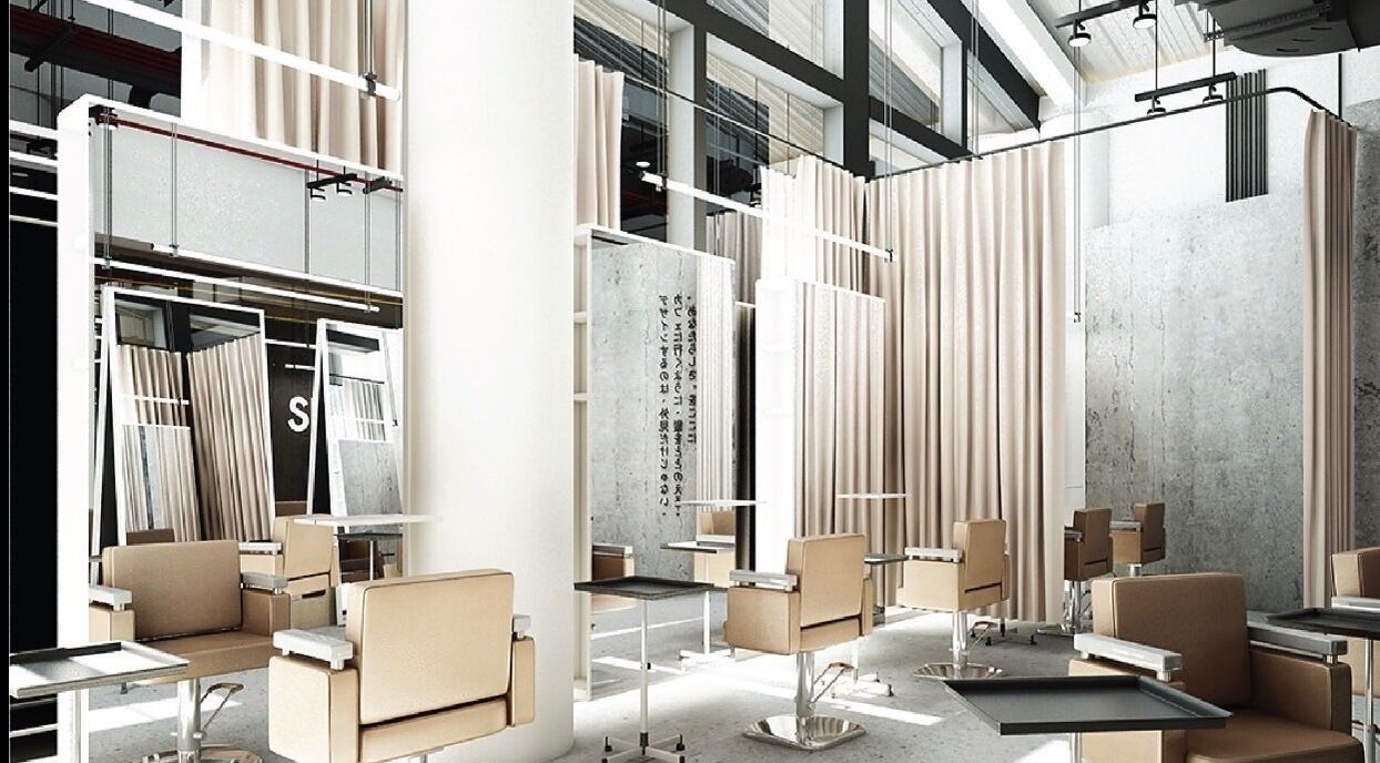 Modern salon interior at SHIN by AKIENDO in Krung Thep Maha Nakhon with sleek chairs and mirrors.