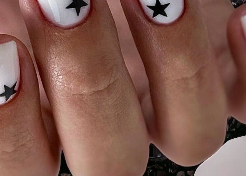 Black star nail art at Nail Art Studio in Gainsborough, England, GB showcasing trendy manicure.