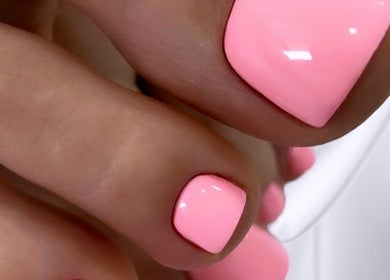 Vibrant pink pedicure at Nail Art Studio, Gainsborough, England, GB showcasing expert nail craftsmanship.