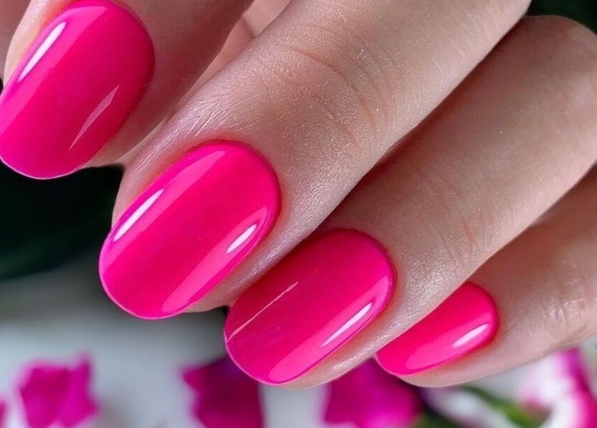 Vibrant pink manicure at Nail Art Studio in Gainsborough, England, GB.