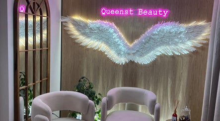 Elegant seating with angel wings decor at QueenSt. Beauty Lounge, Perth, Western Australia, AU.