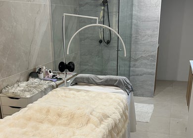 Serene spa room at QueenSt. Beauty Lounge, Perth, Western Australia, AU with plush bedding and elegant decor.