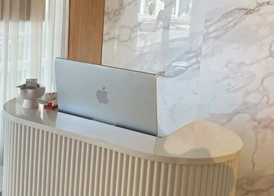 Sophisticated reception desk at QueenSt. Beauty Lounge, Perth, Western Australia, AU showcasing modern elegance.