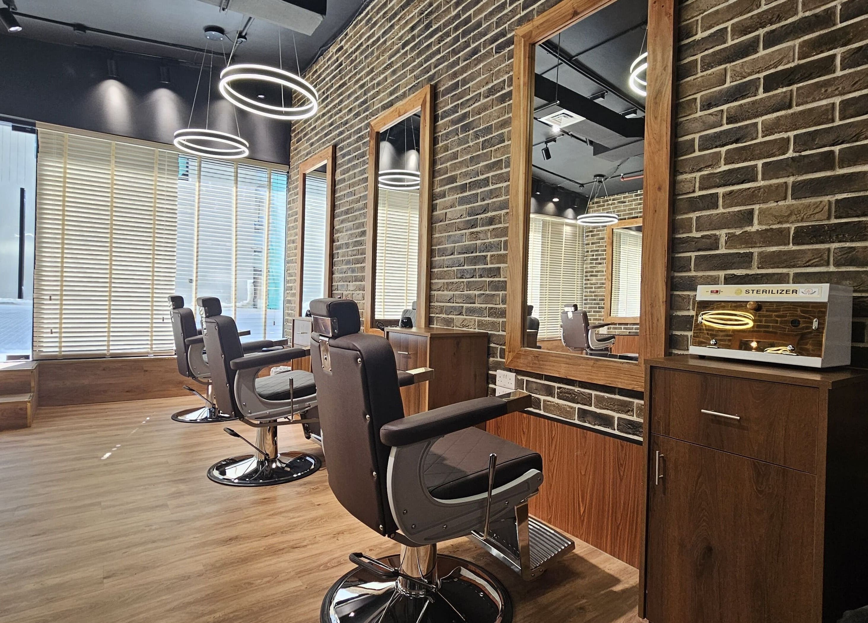 Modern barber chairs at Peaky Blinders | Five JVC, Dubai, Dubai, AE offering stylish grooming ambiance.
