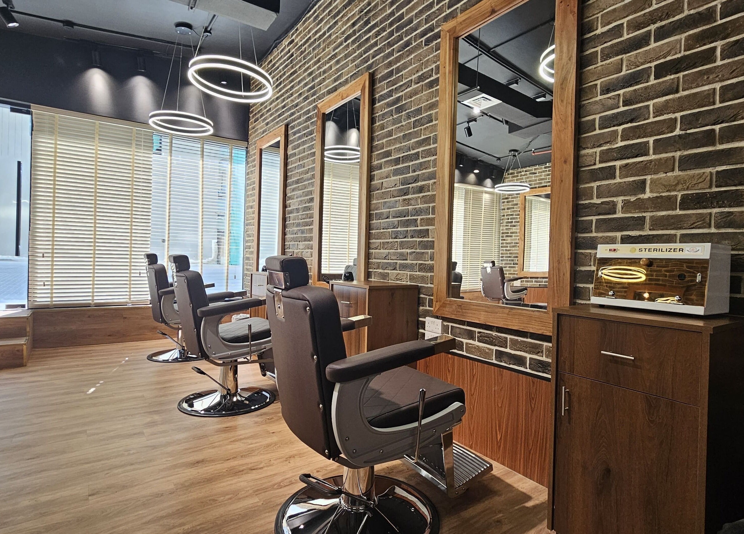 Modern barber chairs at Peaky Blinders | Five JVC, Dubai, Dubai, AE offering stylish grooming ambiance.