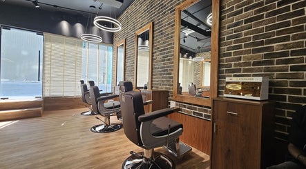 Modern barber chairs at Peaky Blinders | Five JVC, Dubai, Dubai, AE offering stylish grooming ambiance.