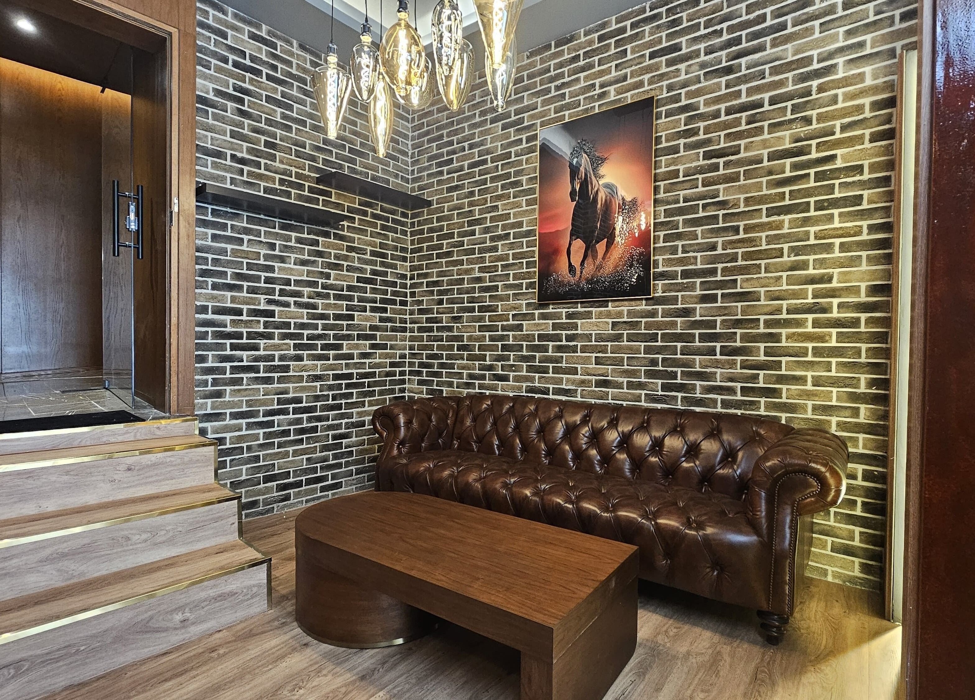 Cozy lounge with leather sofa at Peaky Blinders | Five JVC, Dubai, Dubai, AE.