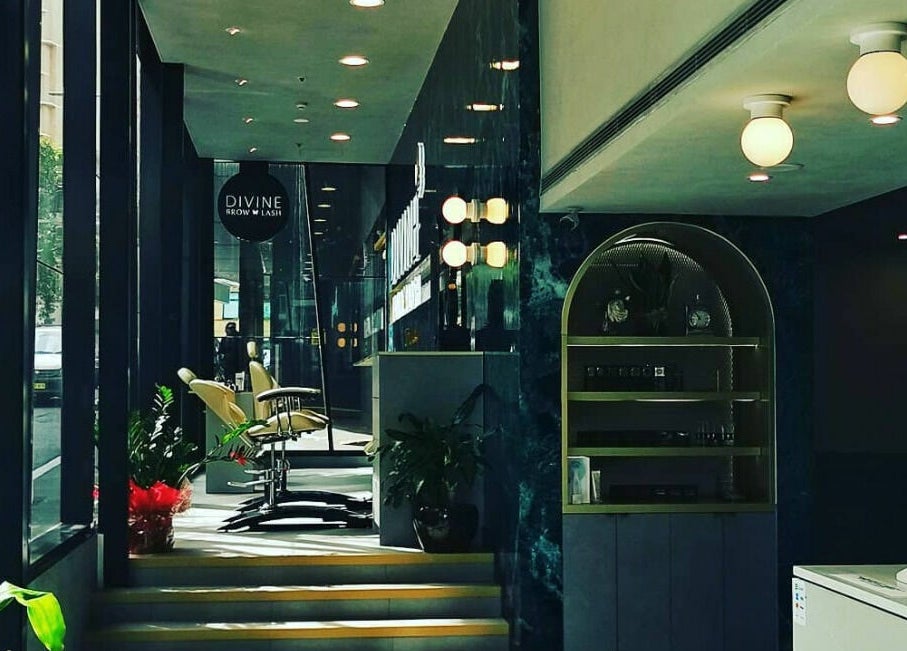 Elegant interior of Divine Brow Lash & Skincare - Surry Hills, New South Wales, AU with plush seating and ambient lighting.