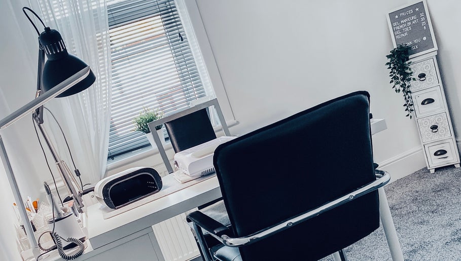 Modern nail studio at Truly Nails, Cadishead, England, GB with sleek furniture and desk lighting.