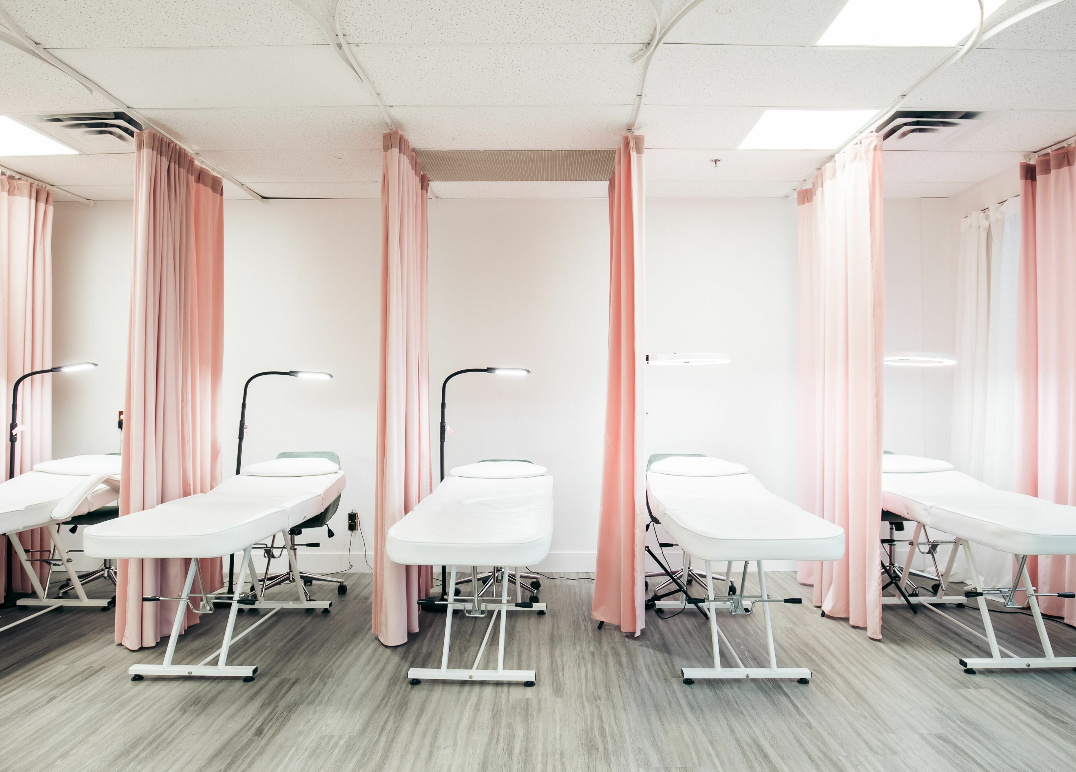 Chic treatment beds at The Hive Beauty in Langley Township, British Columbia, CA create a relaxing atmosphere.