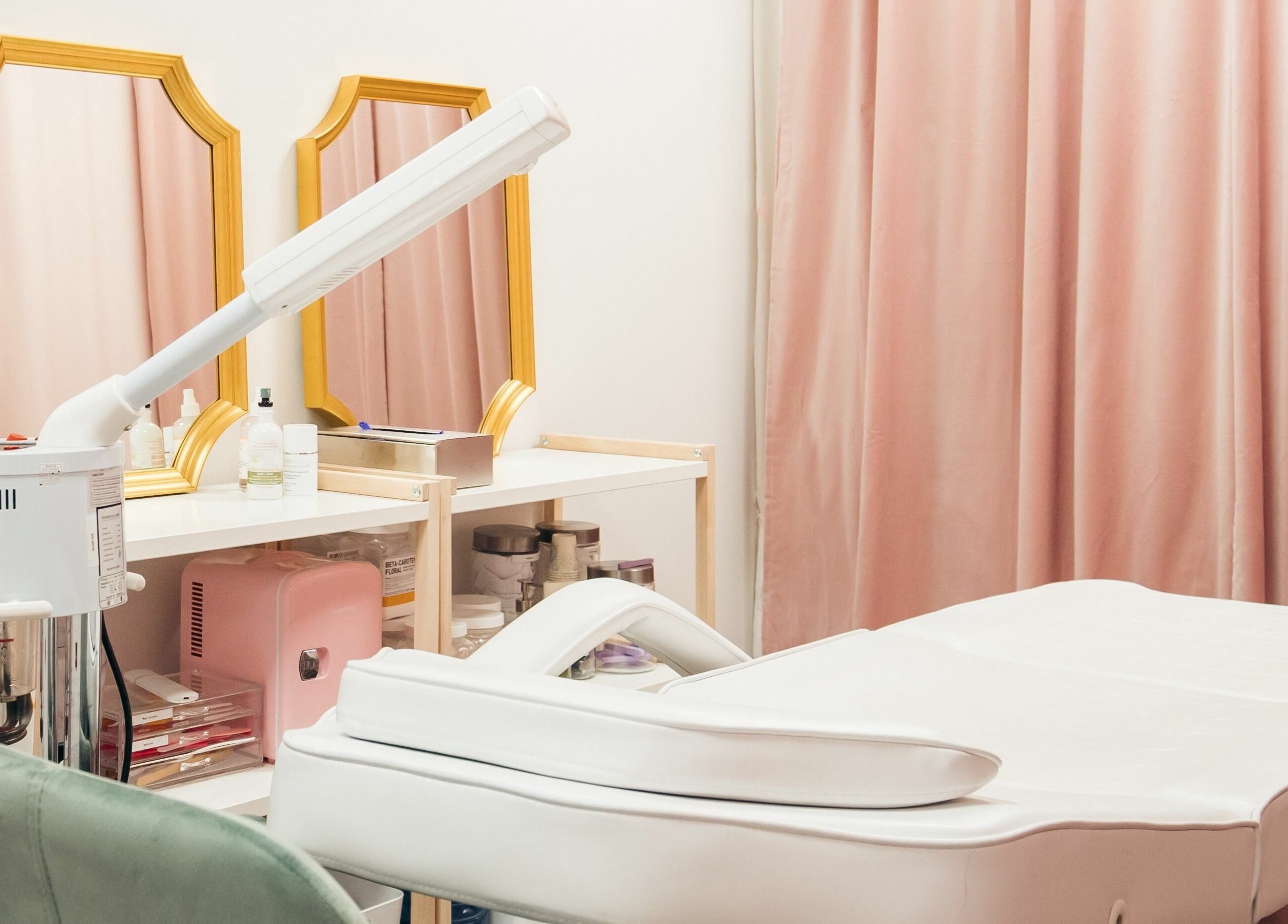 Chic treatment room at The Hive Beauty in Langley Township, British Columbia, CA with mirrors and beauty equipment.