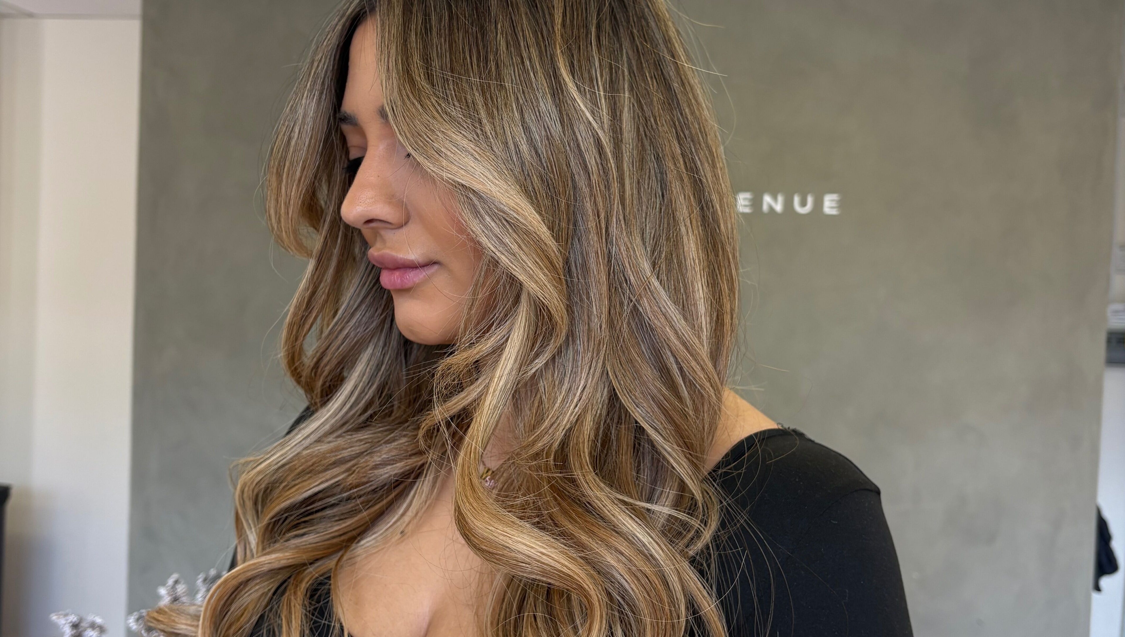 Side view of luxurious blonde waves styled at Seventh West Avenue, Birmingham, England, GB.