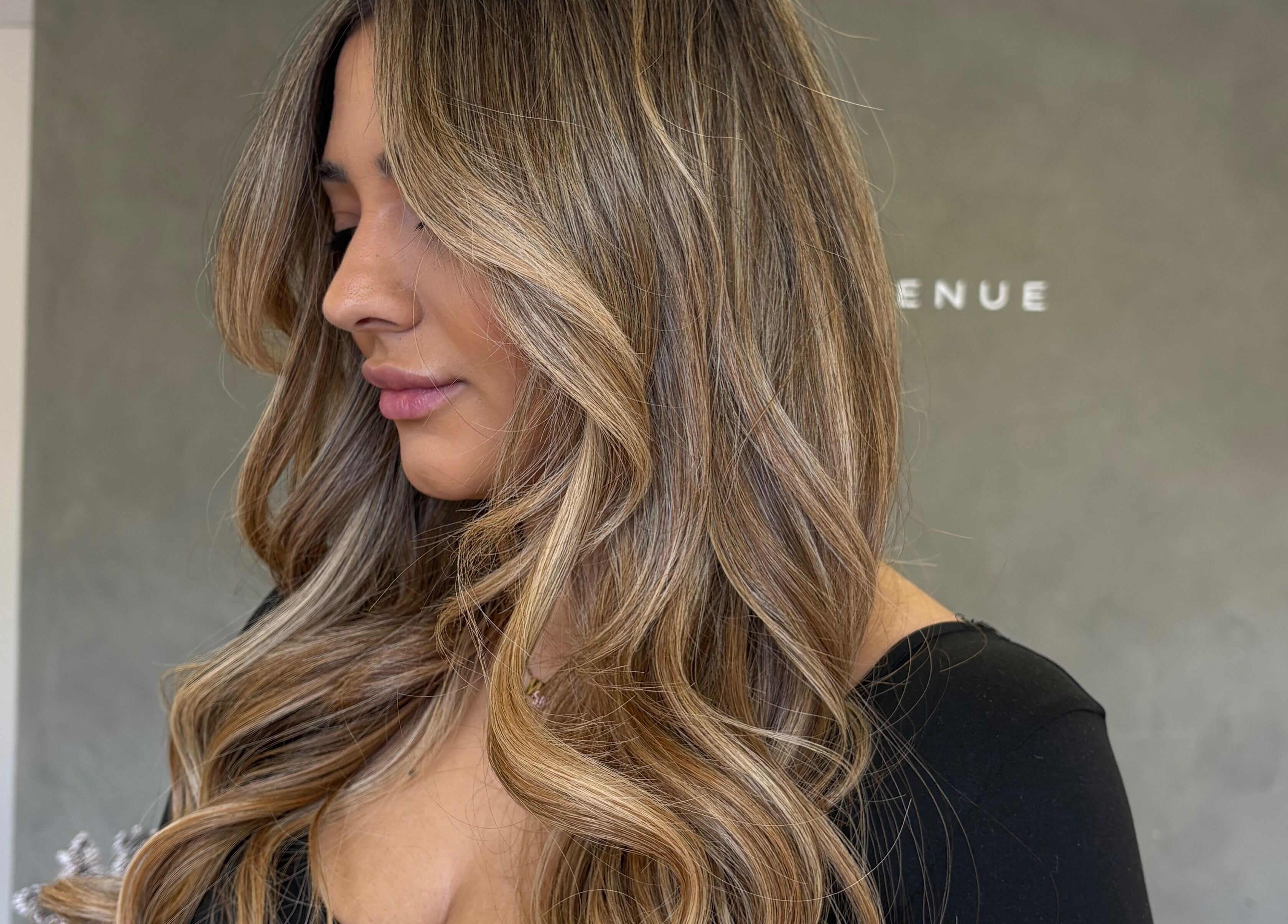 Side view of luxurious blonde waves styled at Seventh West Avenue, Birmingham, England, GB.