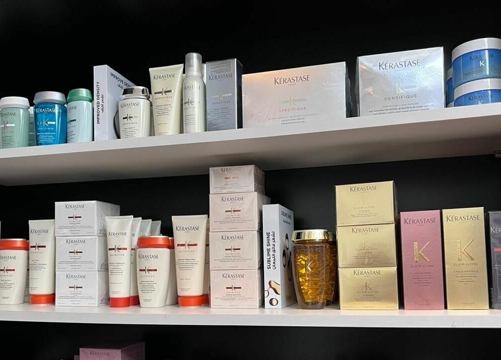 Kerastase hair products neatly arranged on shelves at Robert Alexander Salon, Dubai, Dubai, AE.
