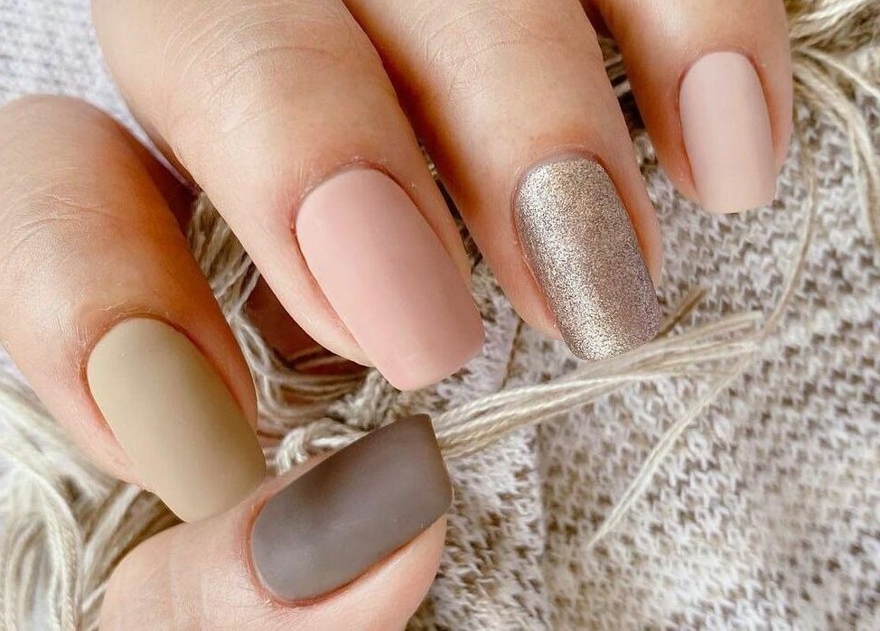 Chic manicure at Robert Alexander Salon, Dubai, Dubai, AE. Soft tones and glitter accent nail.