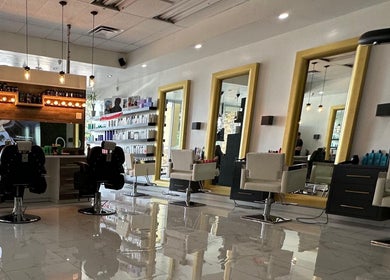 Modern interior of Leonardo Trigueros Salon & Spa in Fort Lauderdale, Florida, US featuring stylish salon chairs.