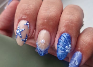 Blue sea-themed nail art at Dragonfly Beauty, South Hiendley, England, GB.