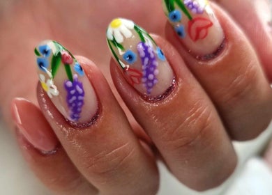 Floral nail art design at Dragonfly Beauty, South Hiendley, England, GB showcasing vibrant, detailed flowers.