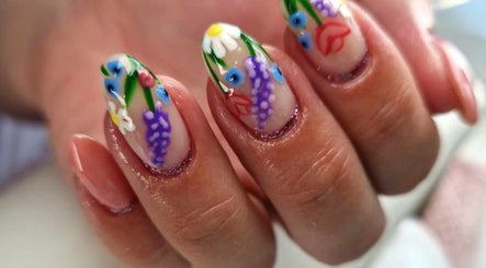 Floral nail art design at Dragonfly Beauty, South Hiendley, England, GB showcasing vibrant, detailed flowers.