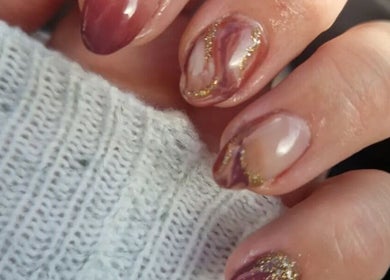 Chic marble nail art with gold accents at Dragonfly Beauty, South Hiendley, England, GB.