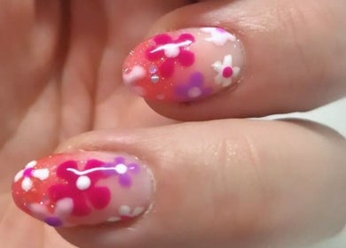 Floral nail art by Dragonfly Beauty, South Hiendley, England, GB, showcasing pink and purple designs.