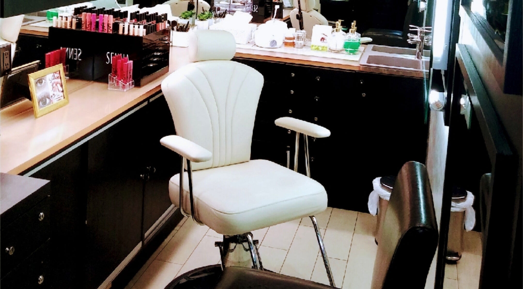 Elegant makeup station at Makeup by Chanette in Los Angeles, California, US, featuring sleek decor and products.