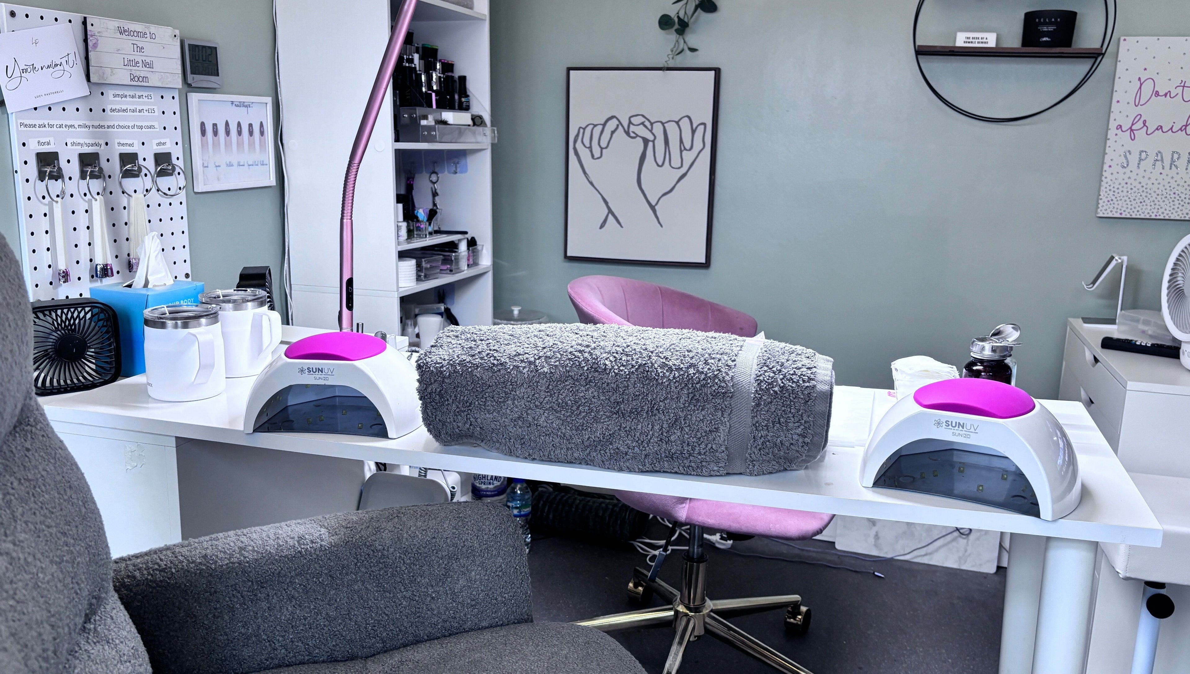 The Little Nail Room in Birmingham, England, GB offers a cozy nail treatment area with plush seating and UV lights.
