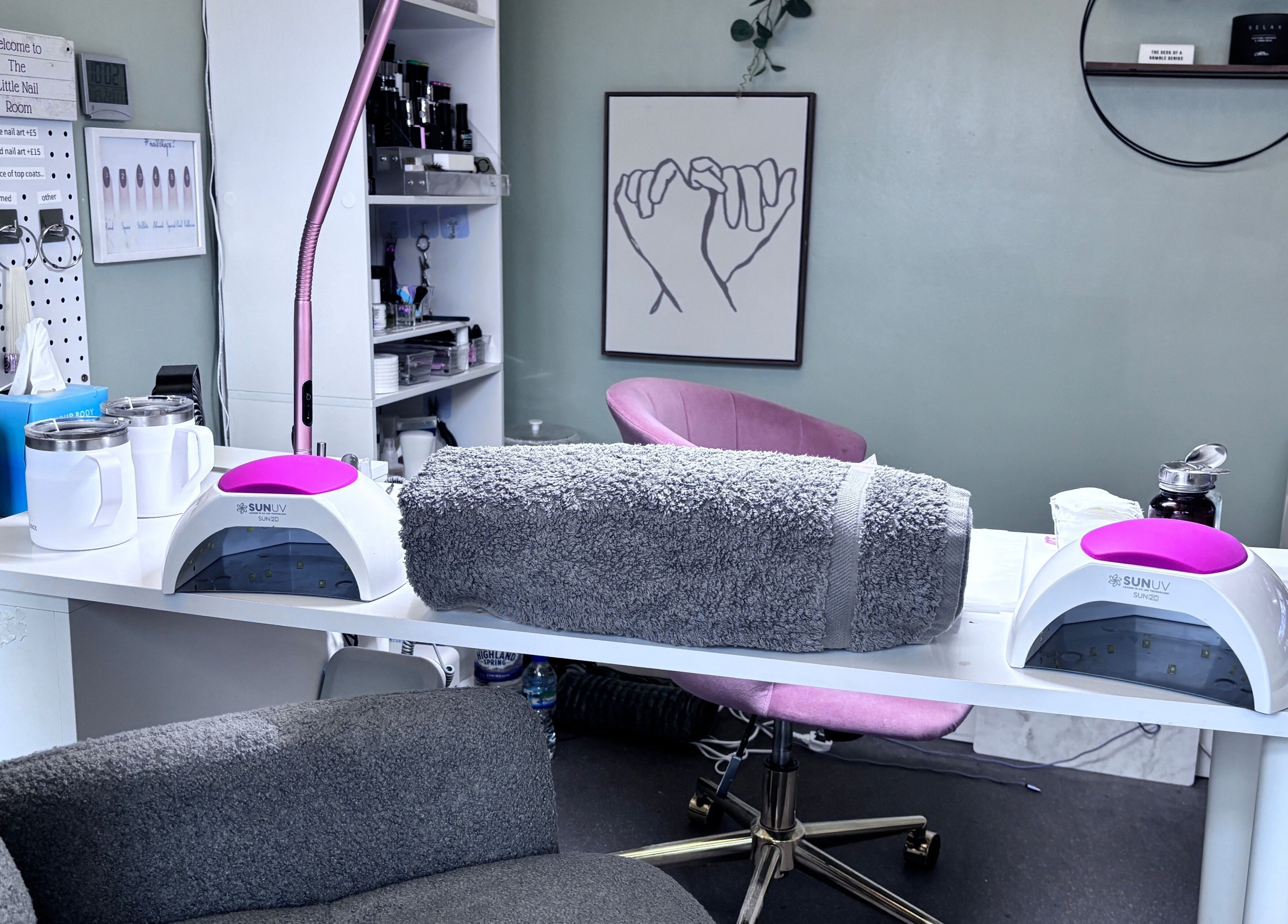 The Little Nail Room in Birmingham, England, GB offers a cozy nail treatment area with plush seating and UV lights.