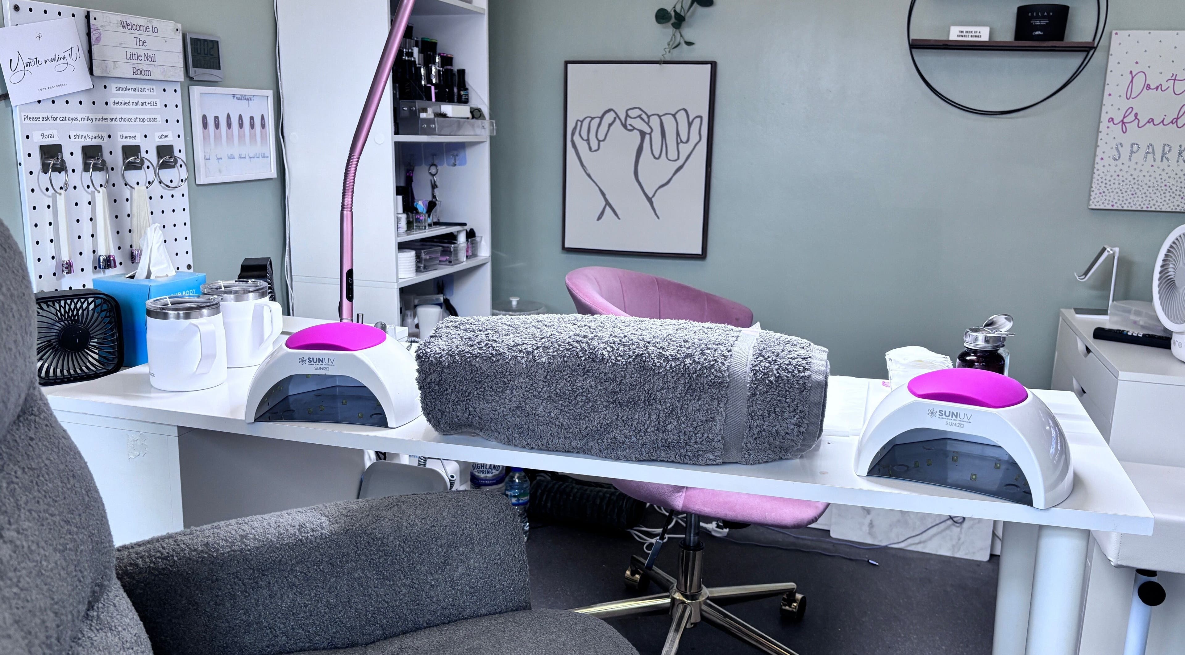 The Little Nail Room in Birmingham, England, GB offers a cozy nail treatment area with plush seating and UV lights.