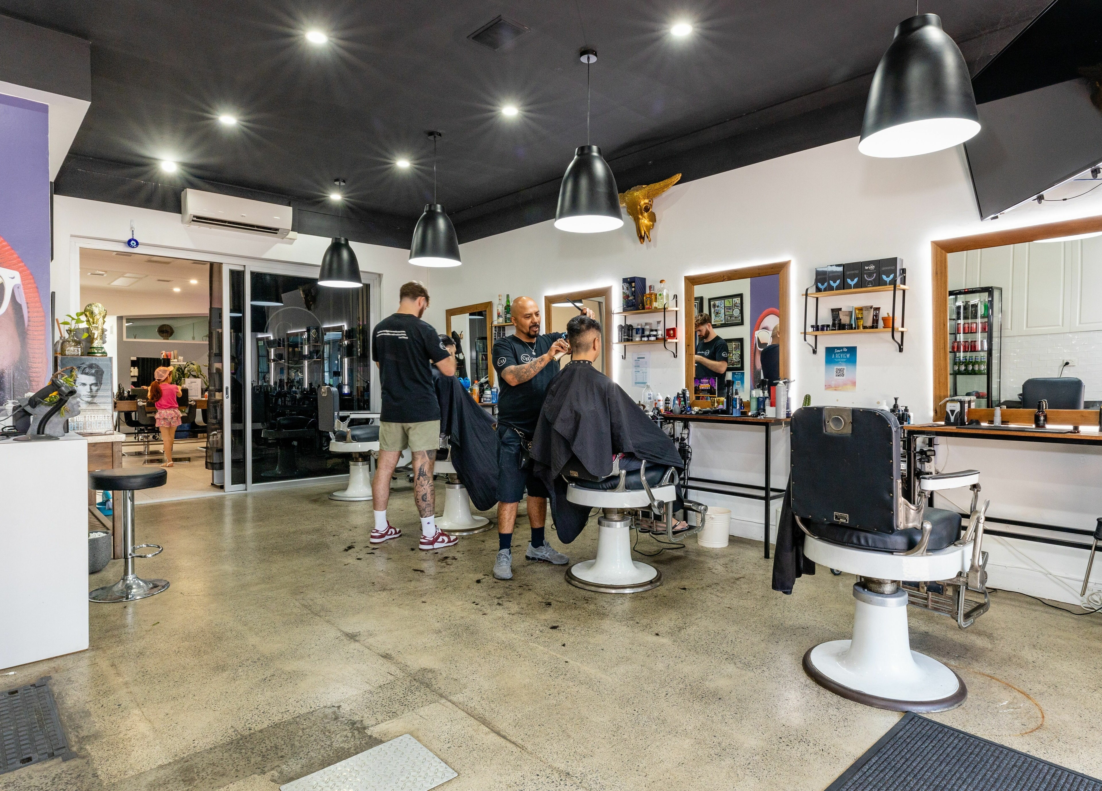 Professional stylists at work in Collective Hair, Mascot, Pensioners 25% Off, AU offering quality service.