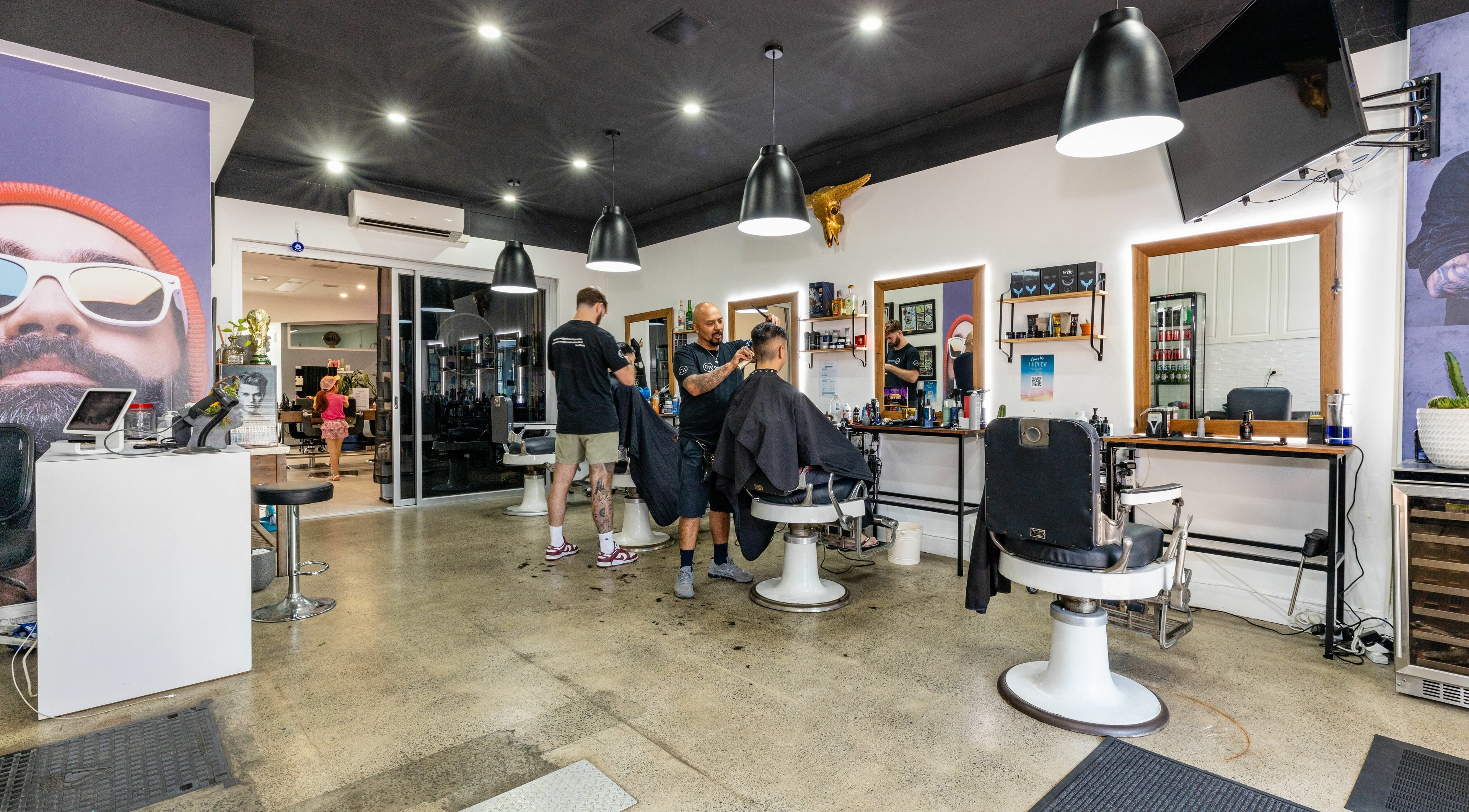 Professional stylists at work in Collective Hair, Mascot, Pensioners 25% Off, AU offering quality service.