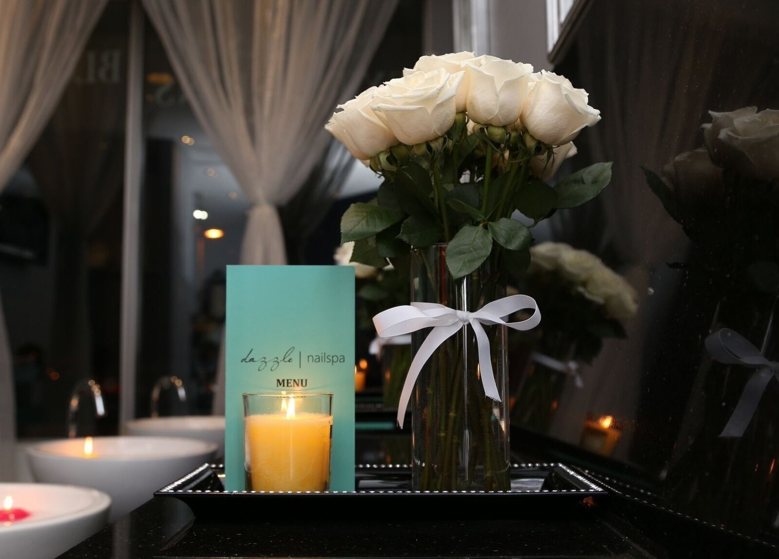 Elegant bouquet and candle at Dazzle Nailspa, Toronto, Ontario, CA. Reflects relaxing ambiance.