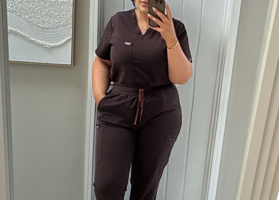 Staff member in uniform at Sarah Gregory Beauty Clinic, Cheshire, England, GB.