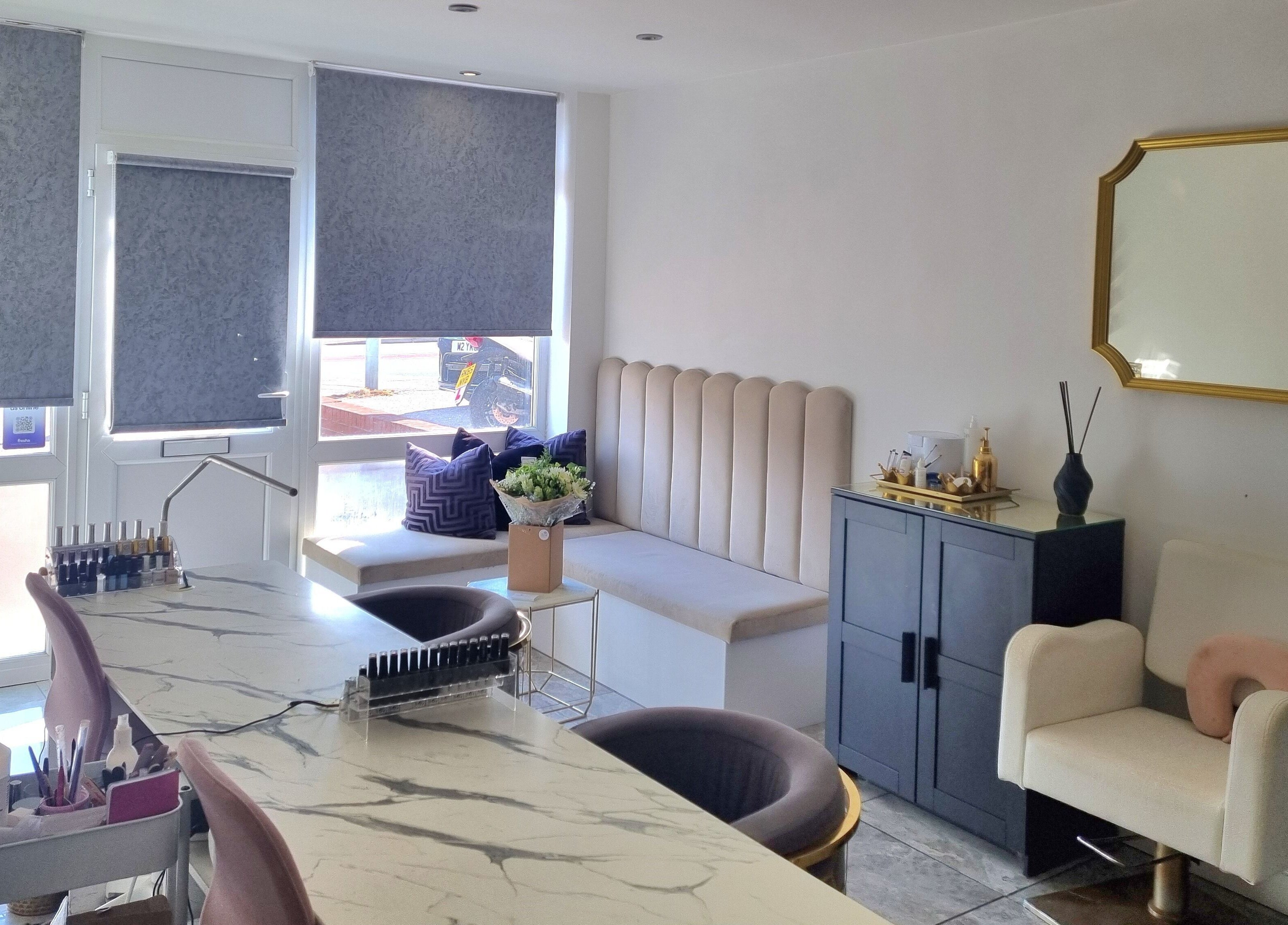 Chic interior of Hiive Expert Nails in Swinton, England, GB featuring stylish seating and manicure stations.