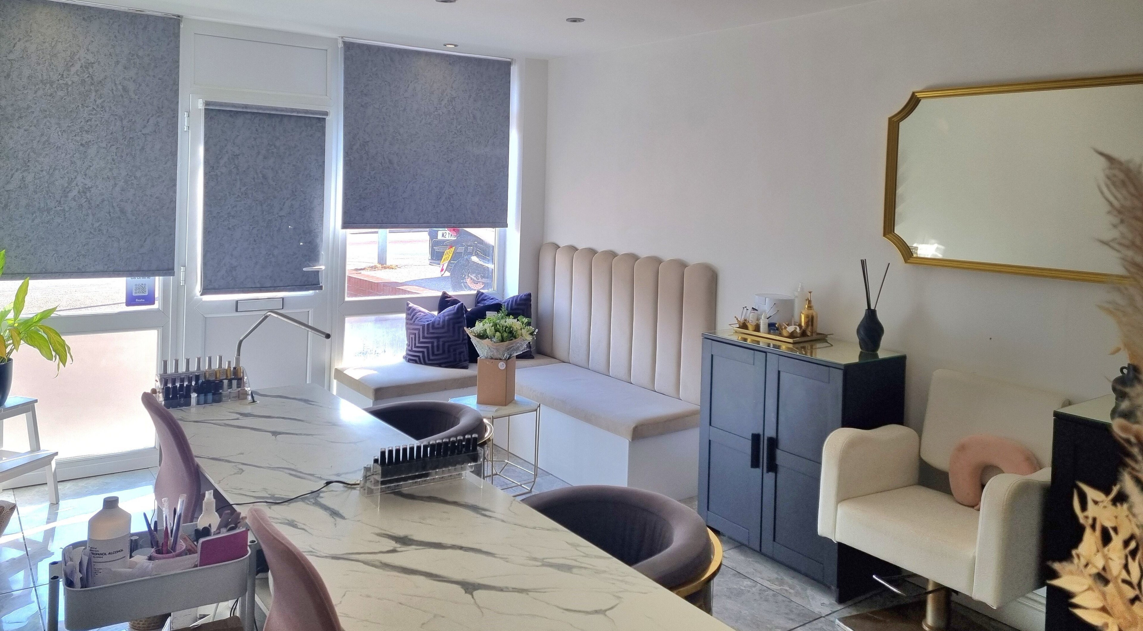 Chic interior of Hiive Expert Nails in Swinton, England, GB featuring stylish seating and manicure stations.