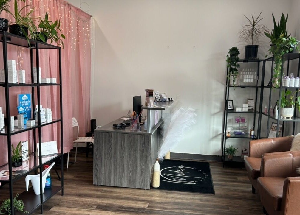 Modern Esthetics lobby with pink curtains, plants, Carstairs, Alberta, CA.