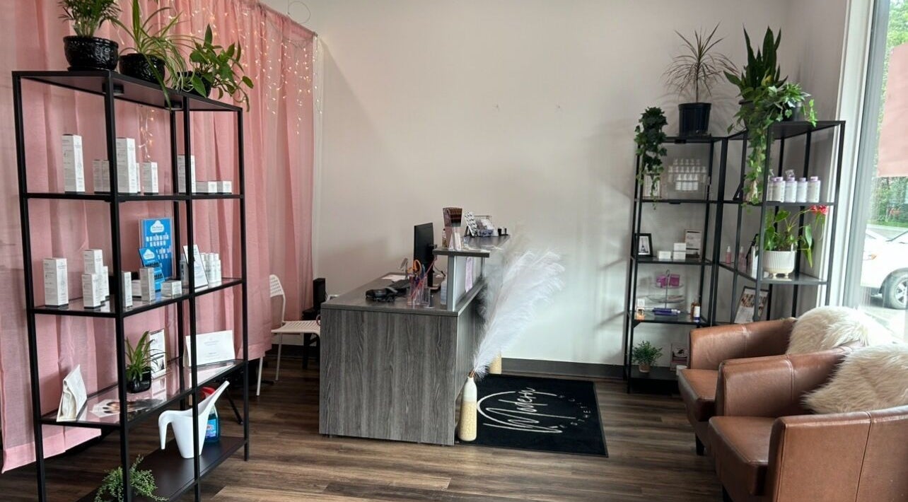 Modern Esthetics lobby with pink curtains, plants, Carstairs, Alberta, CA.