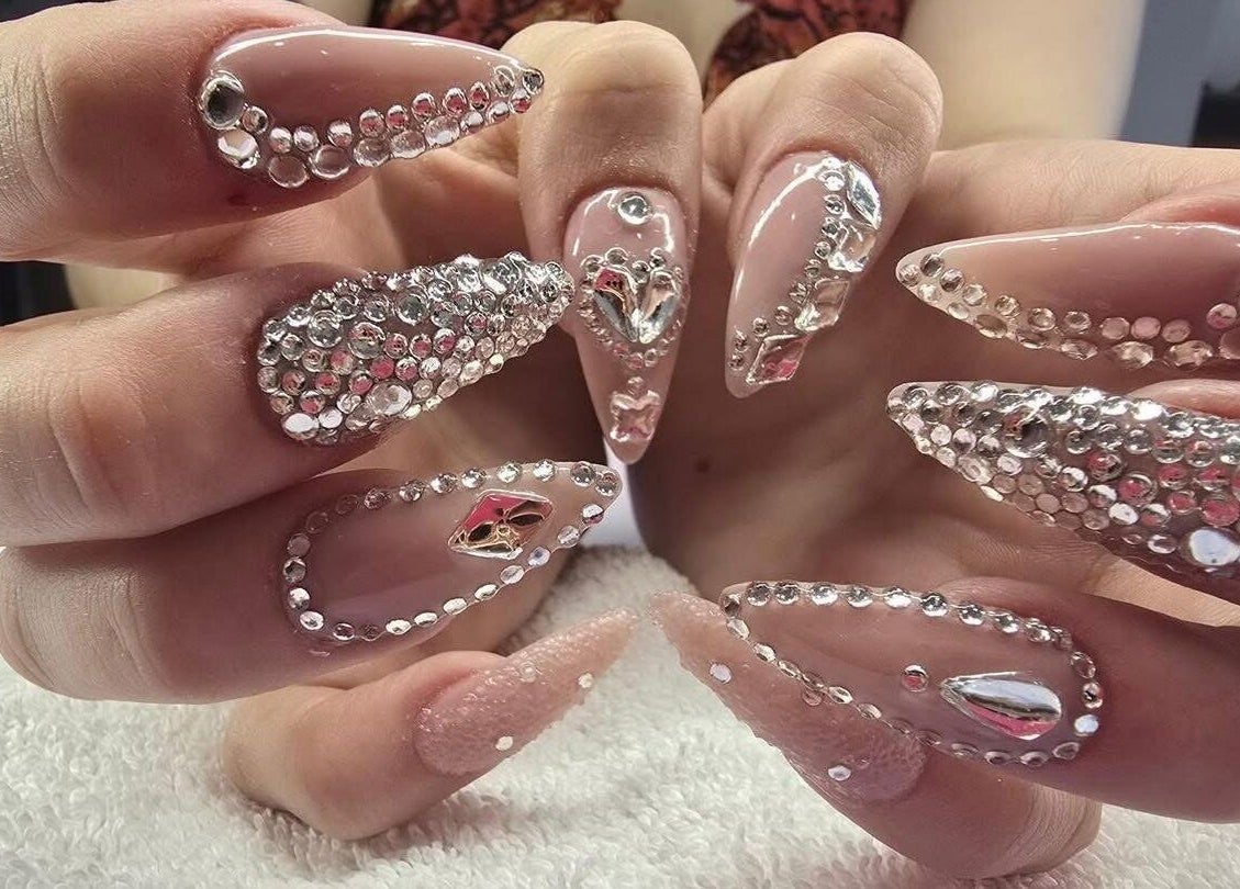 Exquisite rhinestone-studded nails at Modern Esthetics in Carstairs, Alberta, CA for a stylish manicure.